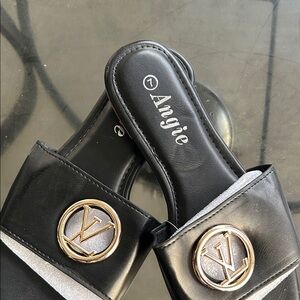 Angie Black Slide Mules with Gold Medallion Accents